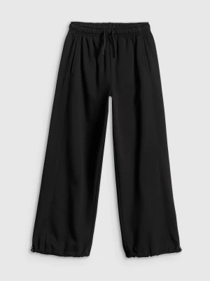 4F Spodnie dresowe z szerokimi nogawkami dziewczęce - czarne 134/140 (8-10 lat)