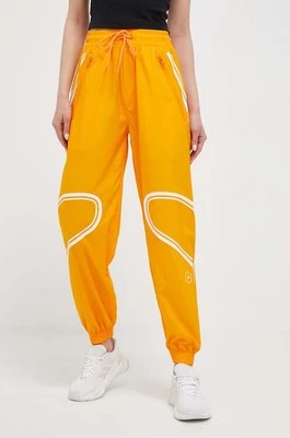 adidas by Stella McCartney spodnie treningowe TruePace kolor pomarańczowy z nadrukiem