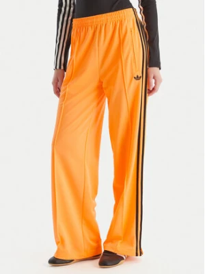 adidas Spodnie dresowe adicolor Classic Firebird JY2694 Żółty Loose Fit