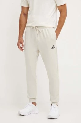 adidas spodnie dresowe Essentials kolor beżowy gładkie JH1039