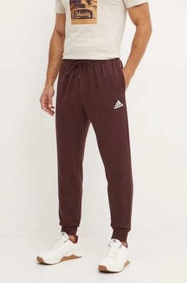 adidas spodnie dresowe Essentials kolor brązowy z aplikacją IY9086