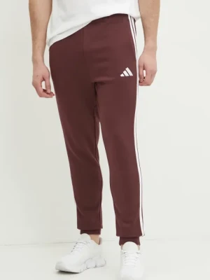 Zdjęcie produktu adidas spodnie dresowe Essentials męskie kolor bordowy z aplikacją JD1853