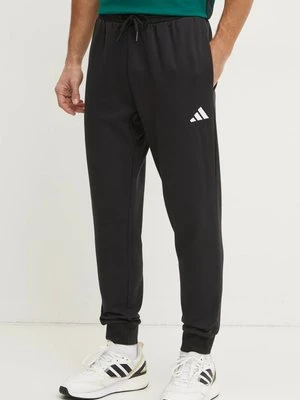 adidas spodnie dresowe Feelcozy kolor czarny gładkie JE3815