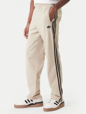 adidas Spodnie dresowe Firebird KE6679 Beżowy Loose Fit