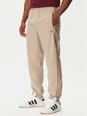 adidas Spodnie dresowe Firebird KS7503 Beżowy Regular Fit