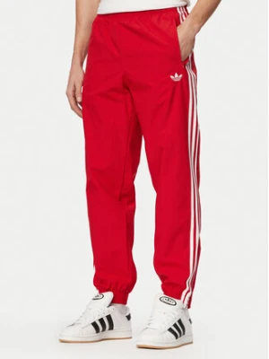 adidas Spodnie dresowe Firebird Woven KE1369 Czerwony Regular Fit