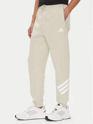 adidas Spodnie dresowe Future Icons 3-Stripes JW7092 Beżowy Regular Fit