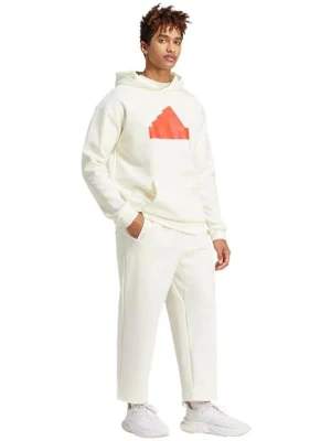 adidas Spodnie dresowe "Future Icons Badge of Sport" w kolorze kremowym rozmiar: M