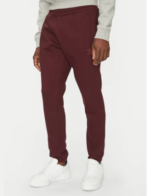 Zdjęcie produktu adidas Spodnie dresowe Trefoil Essentials JD2420 Bordowy Slim Fit