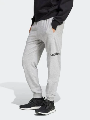 adidas Spodnie dresowe w kolorze szarym rozmiar: M