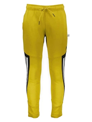 adidas Spodnie dresowe w kolorze żółtym rozmiar: M