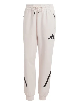 adidas Spodnie dresowe "Z.N.E." w kolorze kremowym rozmiar: S