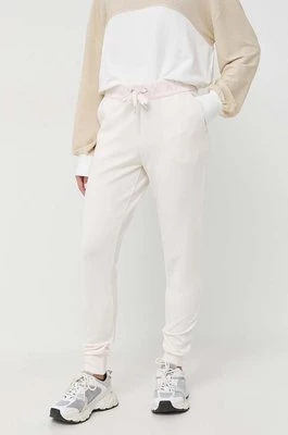 Armani Exchange spodnie dresowe kolor beżowy z nadrukiem