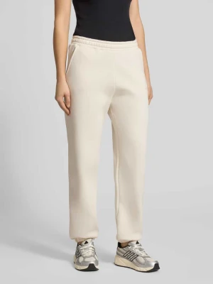 Basic spodnie dresowe ze ściągaczem na dole i bocznymi kieszeniami REVIEW