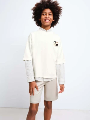 Zdjęcie produktu Bawełniana koszulka oversize z nadrukiem złamana biel - Dzieci - lata - MANGO KIDS