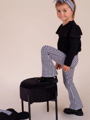 Bawełniane spodnie dresowe dzwony biało-czarne w pepitkę dla dziewczynki Nicol