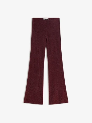 Bershka Błyszczące Spodnie O Kroju Flare Kobieta Bordowy