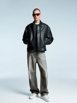 Bershka Jeansy O Kroju Baggy Z Nadrukiem Mężczyzna Czarny