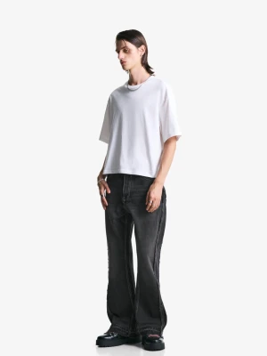 Bershka Jeansy O Kroju Flare Z Frędzlami Mężczyzna Czarny