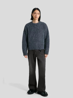 Bershka Jeansy O Kroju Flare Z Frędzlami Mężczyzna Czarny