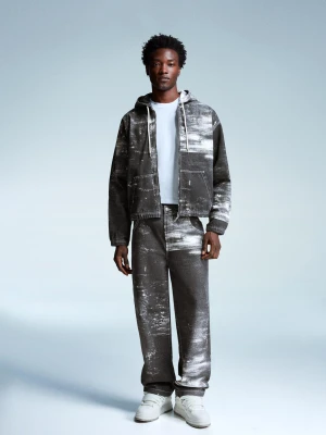 Bershka Jeansy O Kroju Super Baggy Z Nadrukiem Mężczyzna Czarny