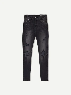 Bershka Jeansy O Kroju Super Skinny Z Efektem Podarcia Mężczyzna Czarny