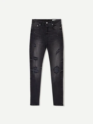 Bershka Jeansy O Kroju Super Skinny Z Efektem Podarcia Mężczyzna Czarny