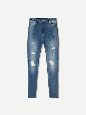 Bershka Jeansy O Kroju Super Skinny Z Efektem Podarcia Mężczyzna Niebieski