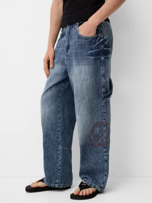 Bershka Jeansy Super Baggy Bershka X No Fear Mężczyzna Niebieski