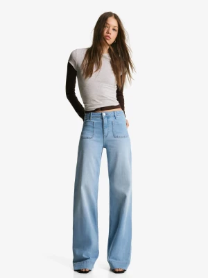 Bershka Jeansy Z Szerokimi Nogawkami I Wysokim Stanem Bezszwowe Kieszenie Kobieta Jasnoniebieski