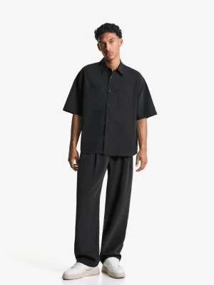 Bershka Spodnie Jogger O Kroju Baggy Mężczyzna Czarny
