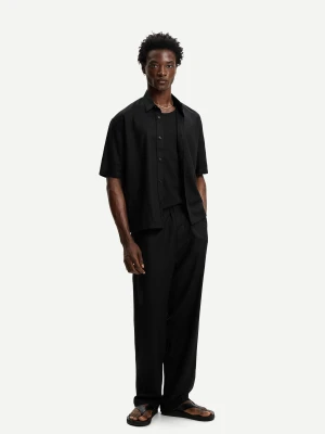 Bershka Spodnie Jogger Z Mieszanki Lnu Z Szerokimi Nogawkami Mężczyzna Czarny