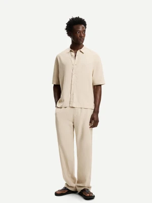 Bershka Spodnie Jogger Z Mieszanki Lnu Z Szerokimi Nogawkami Mężczyzna Piaskowy