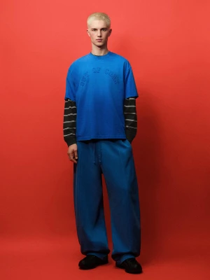 Bershka Spodnie O Kroju Balloon Z Dzianiny Dresowej Out Of Core Mężczyzna Niebieski