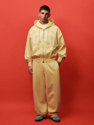 Bershka Spodnie O Kroju Balloon Z Dzianiny Dresowej Out Of Core Mężczyzna Żółty