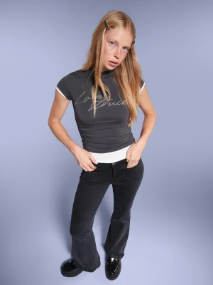 Bershka Spodnie O Kroju Flare Z Kieszeniami Z Patkami Kobieta Czarny