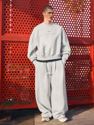 Bershka Spodnie O Kroju Super Baggy Z Zakładkami Mężczyzna Szary