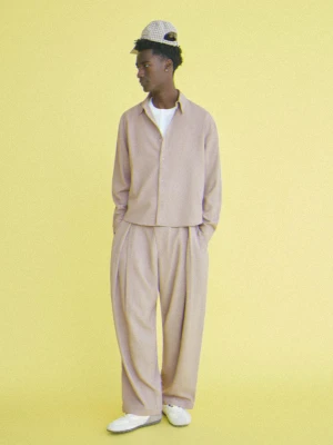 Bershka Spodnie Tailoring O Kroju Baggy Mężczyzna Piaskowy