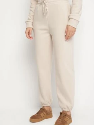 Beżowe Bawełniane Spodnie Dresowe ze Sznurkiem i Polarową Podszewką Saliavera defox