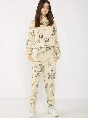 Beżowe spodnie dresowe z nadrukami Reporter