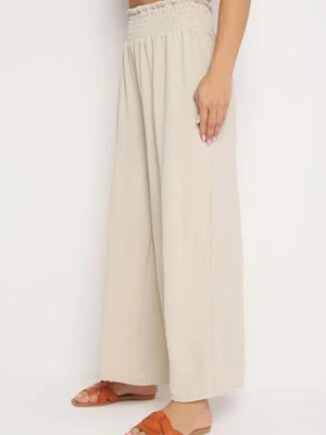Beżowe Szerokie Spodnie z Wysokim Stanem Wykończone Gumką w Pasie Risinassa lovery