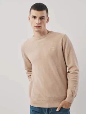 Beżowy bawełniany sweter męski z logo OCHNIK
