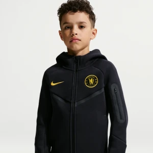 Bluza do piłki nożnej z kapturem i zamkiem na całej długości dla dużych dzieci (chłopców) Nike Chelsea F.C. Tech Fleece - Niebieski