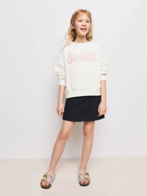 Bluza z błyszczącym napisem złamana biel - Dzieci - lata - MANGO KIDS