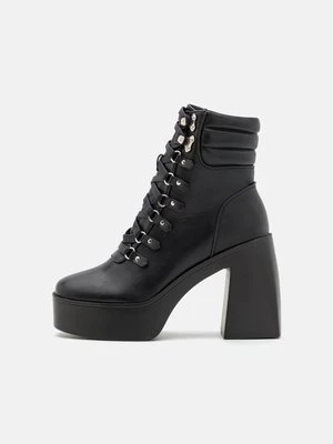 Botki na platformie Raid