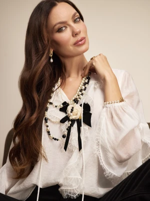 Broszka w kształcie kokardki z kwiatem TARANKO