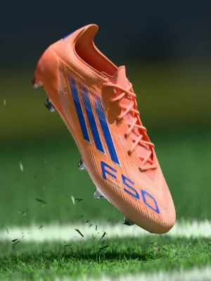 Buty piłkarskie na twardą nawierzchnię Adidas pomarańczowy