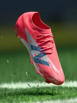Buty piłkarskie na twardą nawierzchnię New Balance czerwony