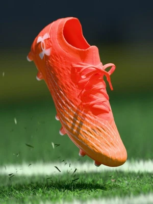 Buty piłkarskie na twardą nawierzchnię Under Armour pomarańczowy