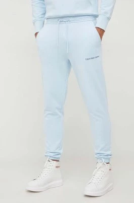 Calvin Klein Jeans spodnie dresowe bawełniane kolor niebieski gładkie